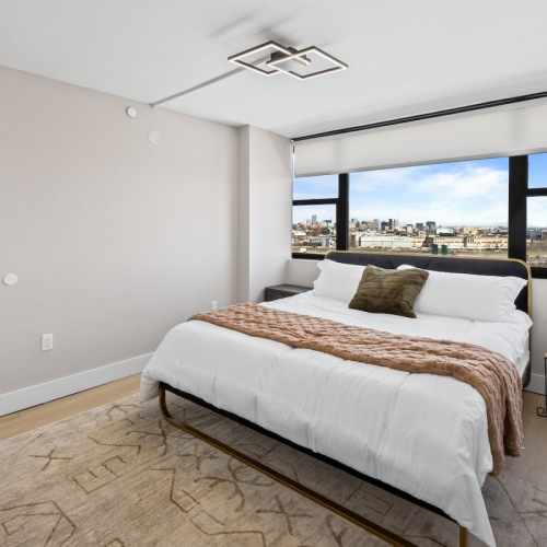 Bedroom with natural lighting and high ceilings