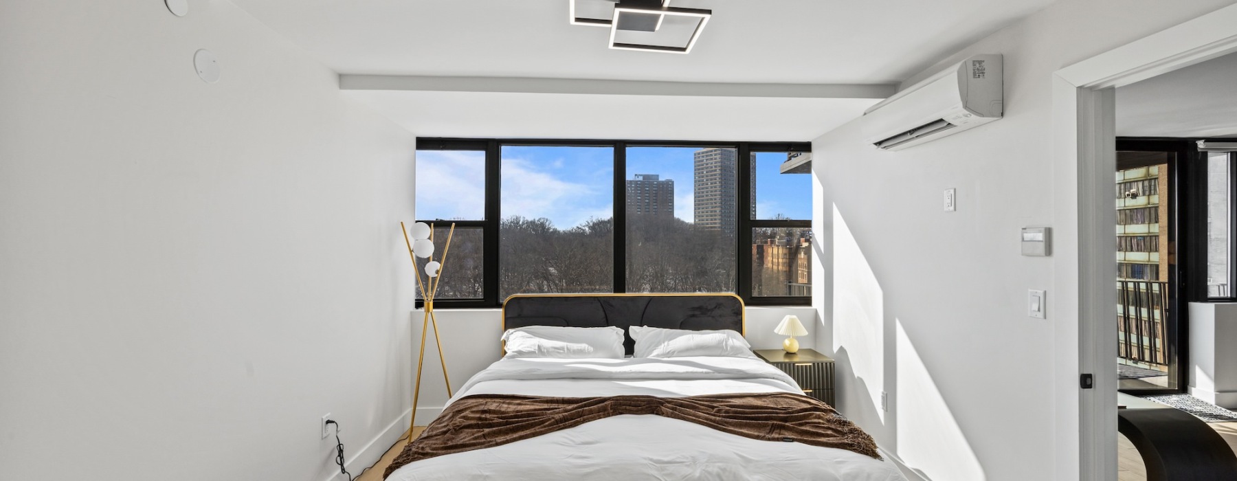 Bedroom with natural lighting and high ceilings